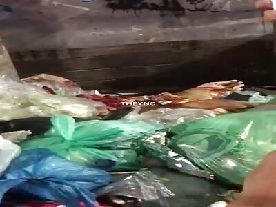 Bags full of meat in the trash