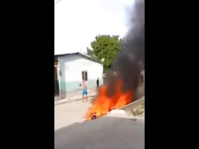 Alleged hitmen were lynched and burned by the people