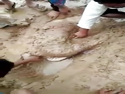 Removing a corpse from the rubble