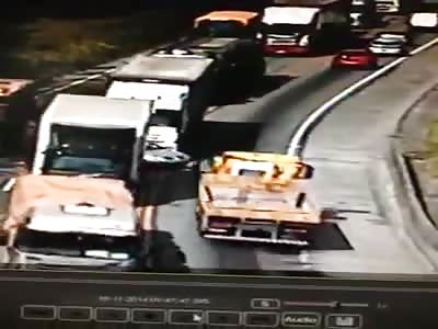 The car gets between the cargo trucks and ends shattered