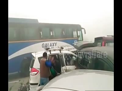 Cars and trucks stuck each other due to fog