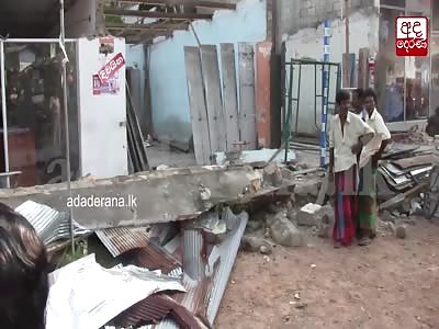 A woman who is submerged by a wall is killed with CCTV displays