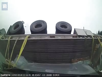 Semi-truck capsizes after ploughing into cars