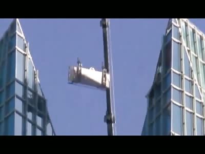 Two window washers trapped on a swinging lift on top of Oklahoma Tower