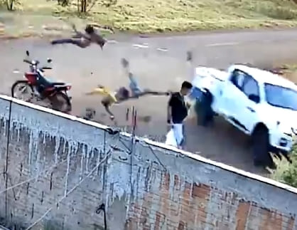 Couple On Bike Meet Truck At Intersection