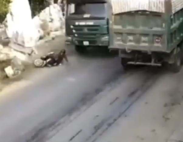 Woman Biker Flattened Under Truck