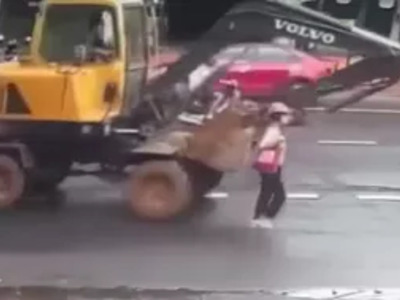 Woman Crushed by Giant Excavator in Middle of Road.