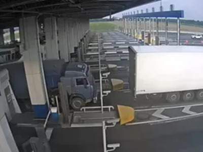 Truck Driver Gets Instant Karma Trying to Avoid Toll