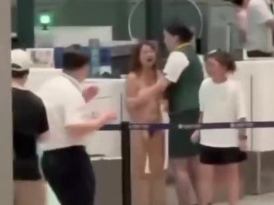 Woman at Airport loses her Mind and Strips Naked