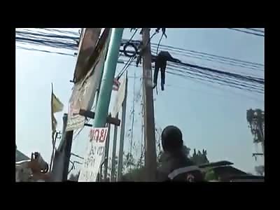 Just a Dead man dangling from the Electric Pole being Removed by the Local Construction Crew