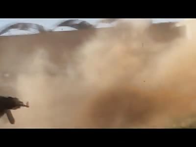 Quick and Brutal Machine Gun Execution of 3 men in the Dirt creates a Dust Cloud