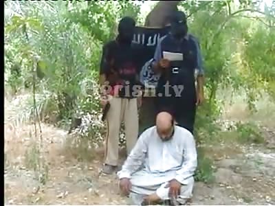 Al Qaeda killing a Shia with a pistol