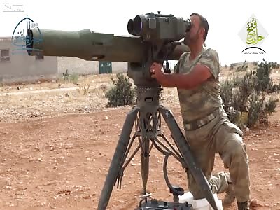  An assad regime armoured earthmover is struck by a TOW ATGM: Tall al-Karasi (Oct 26th, '15) 